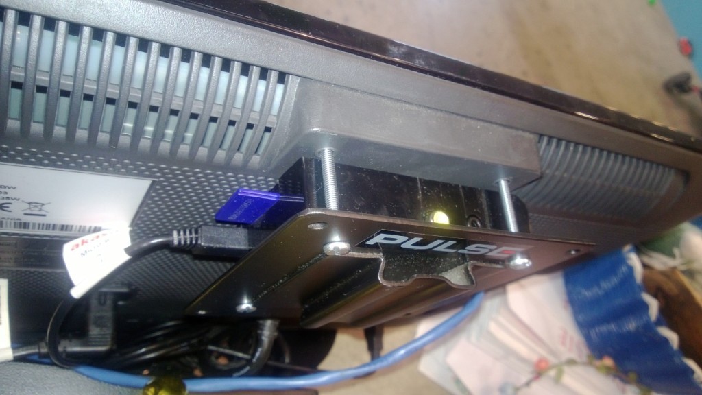 Raspberry Pi mounted on back on monitor using VESA plate
