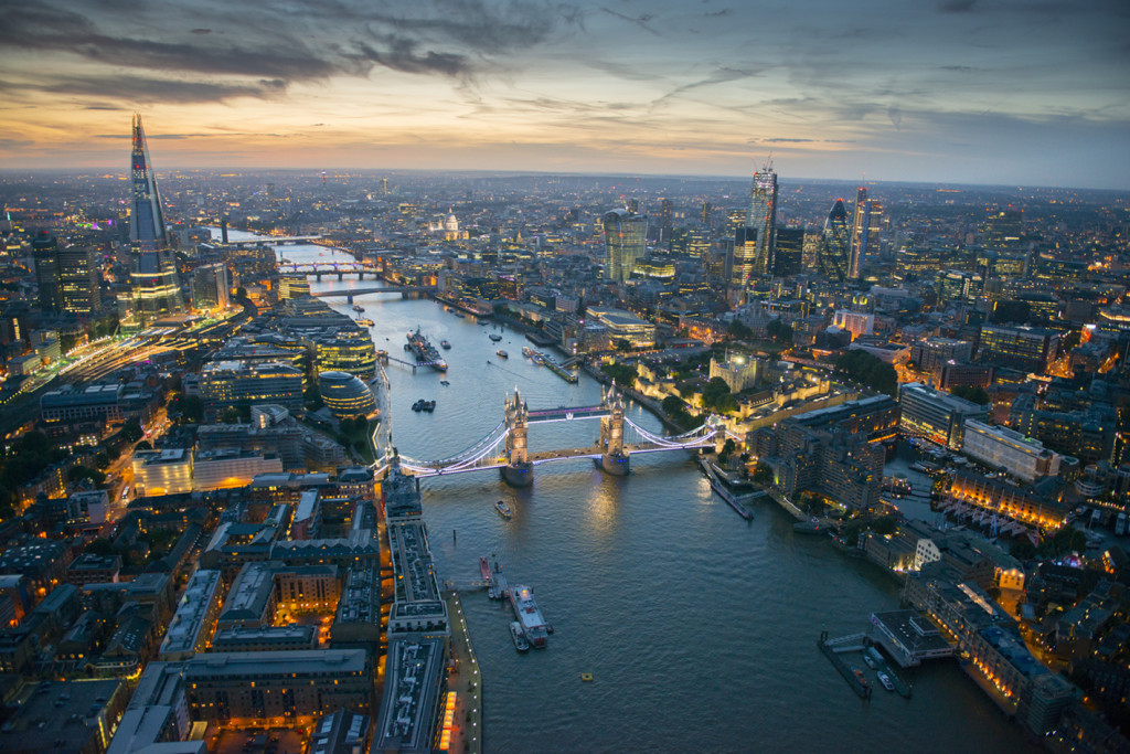 Aerial view of Tower Bridge and the River Thames at night, London